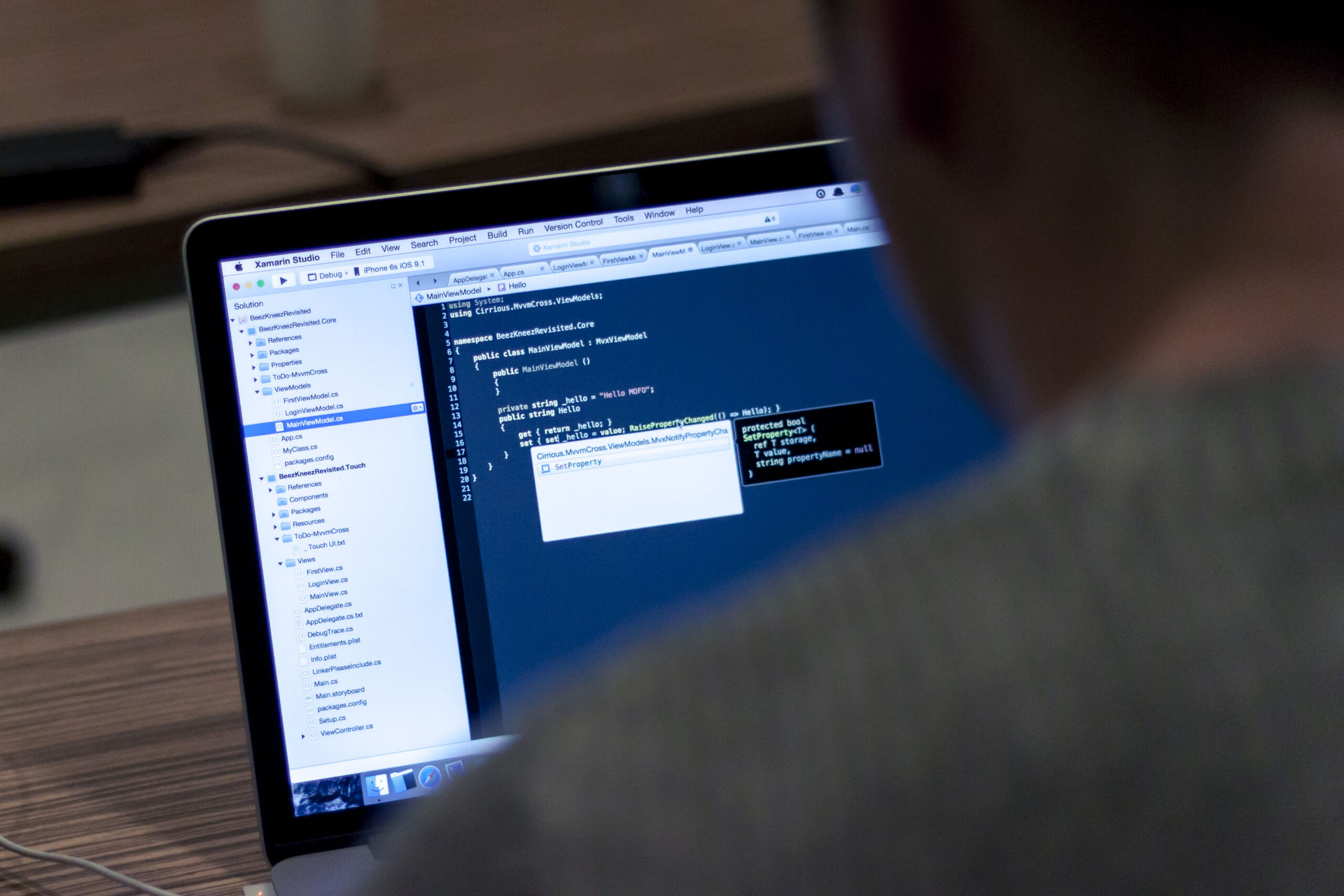 Developer writing code on a laptop for a Docker tutorial for beginners